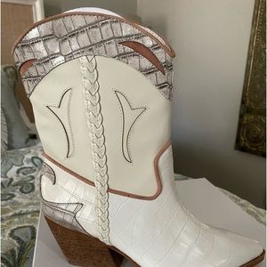 Dolce Vita cowboy Boots. Never worn. Still in box with packing inside boots